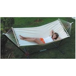 A beige hammock that is suspended between two points, to swing, sleep or rest to tired body outdoors, anchoring you in nature. Today these hammocks are popular around the world and known for its relaxation. These hammocks are an endless way of providing a place in space for yourself and others. Ideal for home uses as well as camping, traveling and lack side settings. Note: no stand included for this product